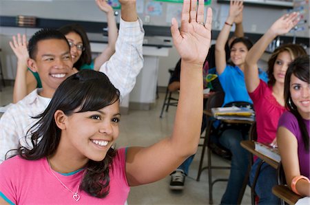 education classroom not adult not illustration and group people - High School Students Raising Their Hands in Class Stock Photo - Premium Royalty-Free, Code: 693-06021056