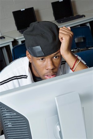 photos of black people in a computer class - High School Student in Class Stock Photo - Premium Royalty-Free, Code: 693-06021170