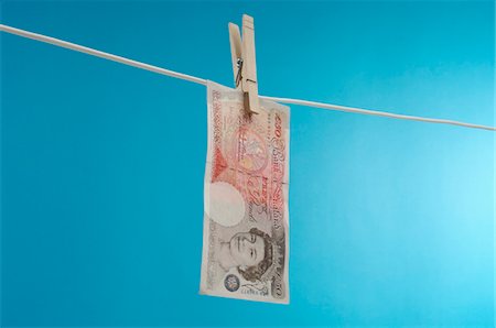 British paper currency on clothesline Stock Photo - Premium Royalty-Free, Code: 693-06021295