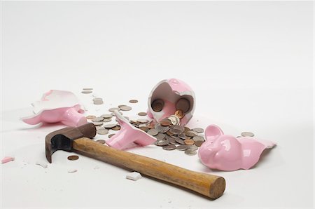 Broken Piggy Bank Stock Photo - Premium Royalty-Free, Code: 693-06021345