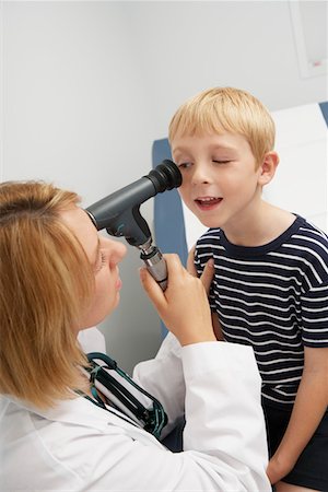 doctor eyes - Female doctor examining boy Stock Photo - Premium Royalty-Free, Code: 693-06021421