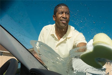 Man washing car Foto de stock - Sin royalties Premium, Código: 693-06021437