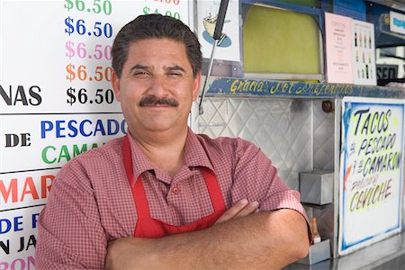 Portrait of man outside cafe Stock Photo - Premium Royalty-Free, Code: 693-06021523