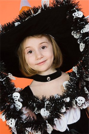 simsearch:693-06021611,k - Portrait of girl (7-9) wearing witch costume for Halloween Stock Photo - Premium Royalty-Free, Code: 693-06021607