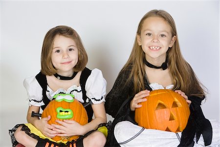 simsearch:693-06021611,k - Portrait of girls (7-9) wearing Halloween costumes, with jack-o-lanterns Stock Photo - Premium Royalty-Free, Code: 693-06021628