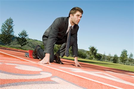 starting block kneeling race track - Businessman At Starting Blocks Stock Photo - Premium Royalty-Free, Code: 693-06021718