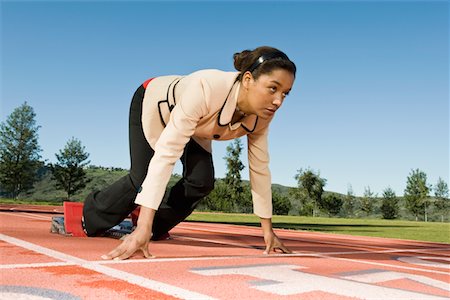 starting block kneeling race track - Businesswoman At Starting Blocks Stock Photo - Premium Royalty-Free, Code: 693-06021719