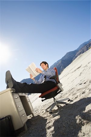 desk in the desert - Businessman Sitting At Desk in the Desert Stock Photo - Premium Royalty-Free, Code: 693-06021765