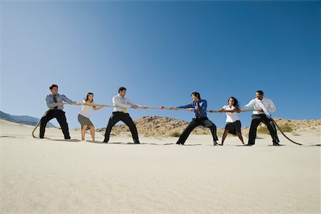 Business People Playing Tug of war in the Desert Stock Photo - Premium Royalty-Free, Code: 693-06021782