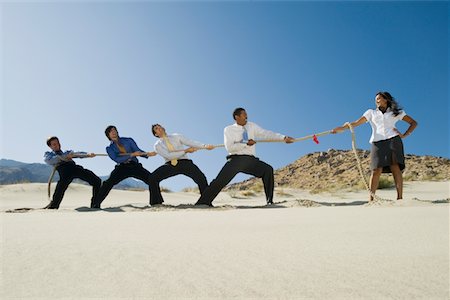 picture of people pulling the rope - Business People Playing Tug of war in the Desert Stock Photo - Premium Royalty-Free, Code: 693-06021783