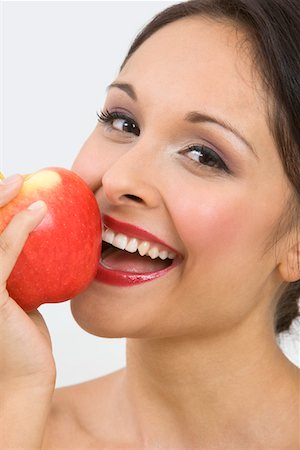 simsearch:693-06021794,k - Woman eating apple Stock Photo - Premium Royalty-Free, Code: 693-06021796