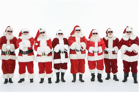 papá noel - Groupe d'hommes habillés en père Noël, lunettes de soleil Photographie de stock - Premium Libres de Droits, Code: 693-06021804