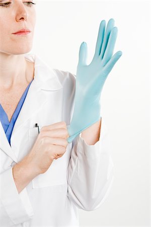 female latex gloves - Doctor with rubber glove Foto de stock - Sin royalties Premium, Código: 693-06021987