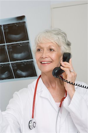 Senior medical practitioner holding xray Stock Photo - Premium Royalty-Free, Code: 693-06022027