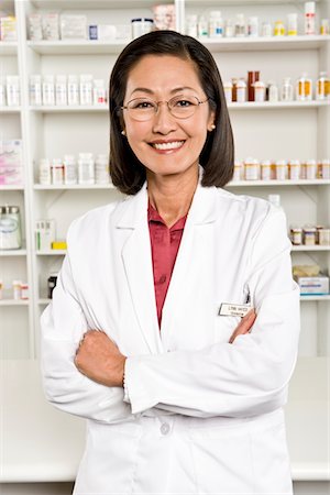 pharmacist looking at camera - Female pharmactist, portrait Stock Photo - Premium Royalty-Free, Code: 693-06022020