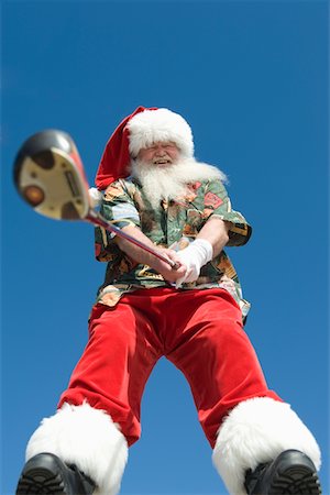 santa claus funny pic - Father Christmas stands with gold club Stock Photo - Premium Royalty-Free, Code: 693-06022072