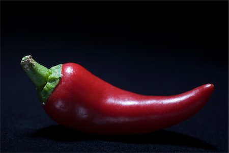 red chili black background - Red chilli pepper Stock Photo - Premium Royalty-Free, Code: 693-06022134