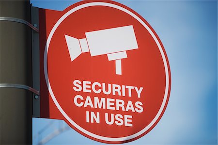 sorveglianza - Security camera sign Fotografie stock - Premium Royalty-Free, Codice: 693-06022139