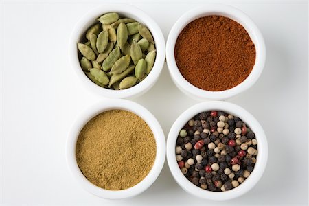 spices bowl closeup - Whole cardamoms, chilli, peppercorns and cumin Stock Photo - Premium Royalty-Free, Code: 693-06022130