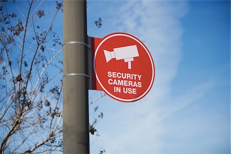 security surveillance - Security camera sign Stock Photo - Premium Royalty-Free, Code: 693-06022140