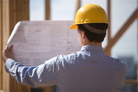 Site manager with building plans Fotografie stock - Premium Royalty-Free, Codice: 693-06022183