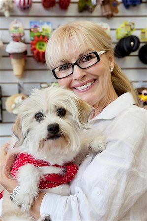 dog usa - Portrait of senior pet owner shop with dog Stock Photo - Premium Royalty-Free, Code: 693-06120786