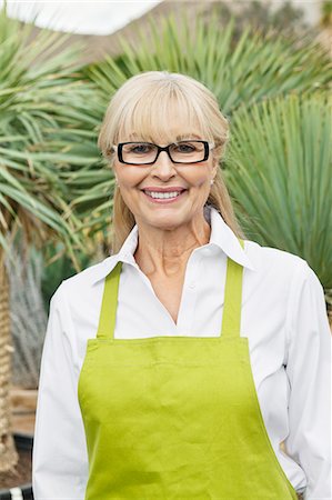 senior woman gardening - Portrait of a senior florist in greenhouse Stock Photo - Premium Royalty-Free, Code: 693-06120939