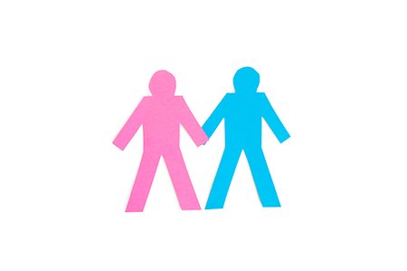 figura adesiva - Paper cut out figures holding hands over white background Foto de stock - Royalty Free Premium, Número: 693-06324333