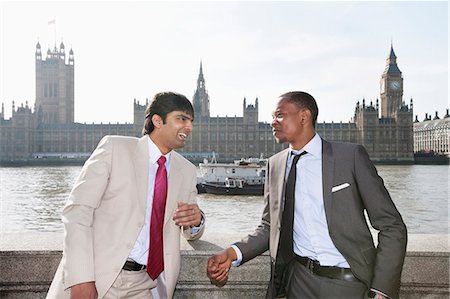 Two multi ethnic businessmen having a conversation Stock Photo - Premium Royalty-Free, Code: 693-06324361