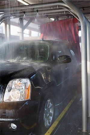 Spraying water on automobile in car wash Stock Photo - Premium Royalty-Free, Code: 693-06324581