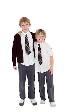 preteens in uniform - Portrait of friends with arms around over white background Stock Photo - Premium Royalty-Free, Code: 693-06324779