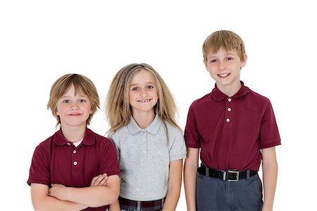 simsearch:693-06324800,k - Portrait of happy school children in uniform over white background Stock Photo - Premium Royalty-Free, Code: 693-06324786