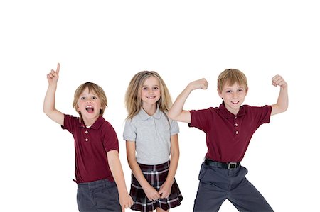 preteen girl arms raised - Portrait of cheerful school children over white background Stock Photo - Premium Royalty-Free, Code: 693-06324787