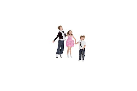 elementary students in uniform photos - School friends holding hands while jumping over white background Stock Photo - Premium Royalty-Free, Code: 693-06324780