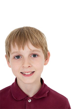 simsearch:693-06324793,k - Close-up portrait of happy blond boy over white background Fotografie stock - Premium Royalty-Free, Codice: 693-06324798