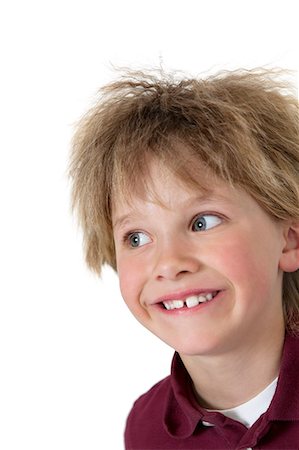 simsearch:693-06324785,k - Close-up of blond boy looking sideways over white background Stock Photo - Premium Royalty-Free, Code: 693-06324801