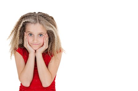 Portrait of bored girl in red outfit over white background Stock Photo - Premium Royalty-Free, Code: 693-06324825