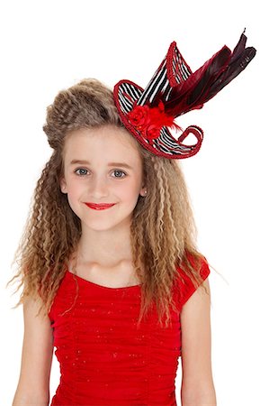 simsearch:693-06324567,k - Portrait of happy girl in red outfit and hat over white background Fotografie stock - Premium Royalty-Free, Codice: 693-06324836