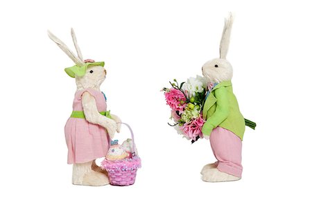 stuffed animals bunny - Stuffed toys portrayed as male with flowers and female with basket over white background Stock Photo - Premium Royalty-Free, Code: 693-06324880