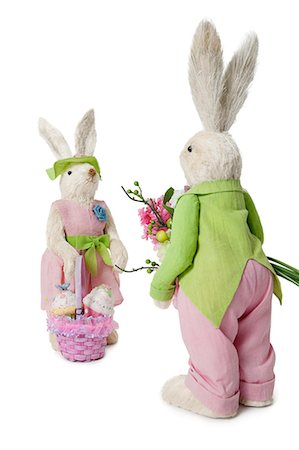 stuffed animals bunny - Male and female Rabbits with flower bouquet and basket over white background Stock Photo - Premium Royalty-Free, Code: 693-06324883