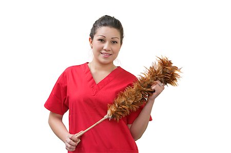 Native American house cleaner holding feather duster over white background Stock Photo - Premium Royalty-Free, Code: 693-06324899