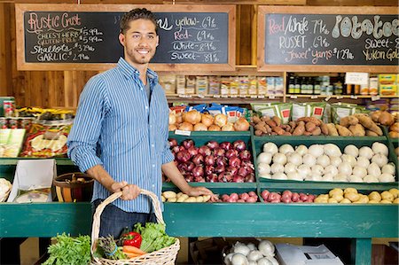 simsearch:693-06324928,k - Handsome young man holding basket at vegetable stall in supermarket Stock Photo - Premium Royalty-Free, Code: 693-06324917