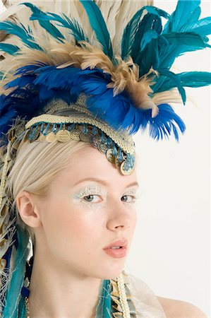 feathers woman - Close-up of beautiful young woman with headdress Stock Photo - Premium Royalty-Free, Code: 693-06325044