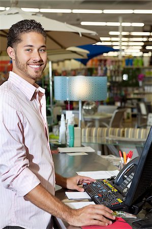 portrait of employees - Portrait of a happy store clerk in shop Stock Photo - Premium Royalty-Free, Code: 693-06325057
