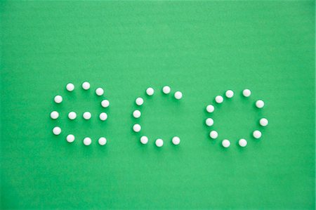 simsearch:693-06325253,k - Close-up of push pins spelling eco over green background Stock Photo - Premium Royalty-Free, Code: 693-06325203