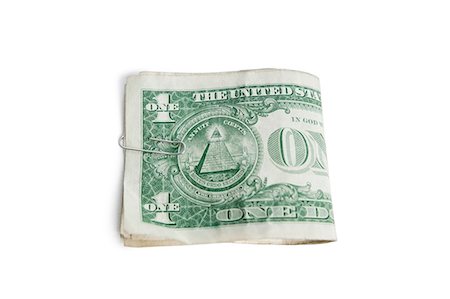 simsearch:614-02838559,k - Close-up of paper dollars in clip over white background Foto de stock - Sin royalties Premium, Código: 693-06325211