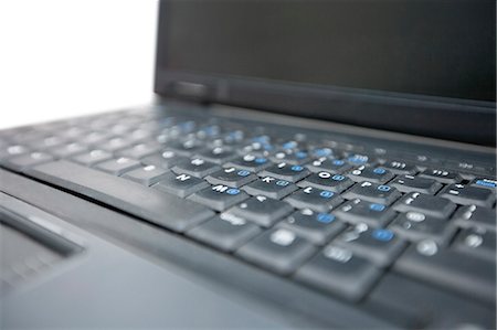 push button - Cropped image of laptop keyboard Stock Photo - Premium Royalty-Free, Code: 693-06325292