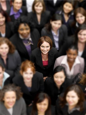 employee top view - High angle view of a businesswoman standing amidst multiethnic businesspeople Stock Photo - Premium Royalty-Free, Code: 693-06325306