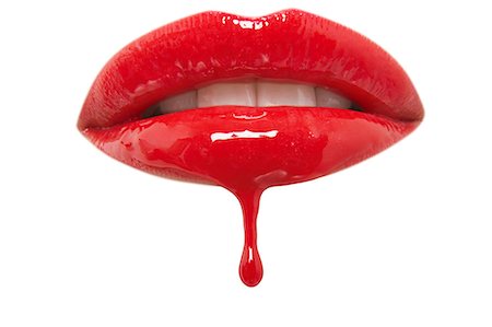 Close-up of red lipgloss dripping from woman's lips over white background Stock Photo - Premium Royalty-Free, Code: 693-06325303