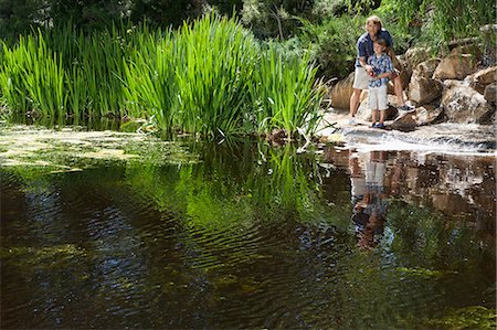 recreation usa - Man and son fishing together by lake Stock Photo - Premium Royalty-Free, Code: 693-06378780